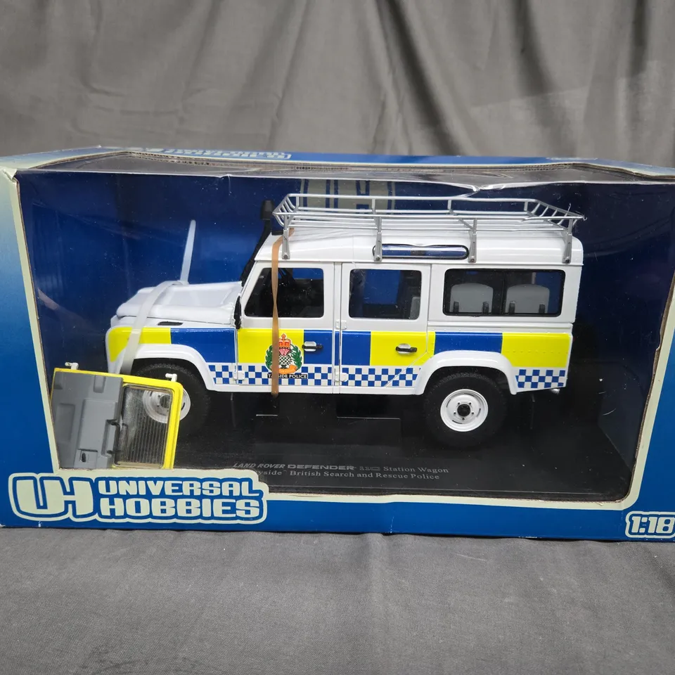 UNIVERSAL HOBBIES - LAND ROVER DEFENDER - 110 STATION WAGON - BRITISH SEARCH AND RECUE POLICE