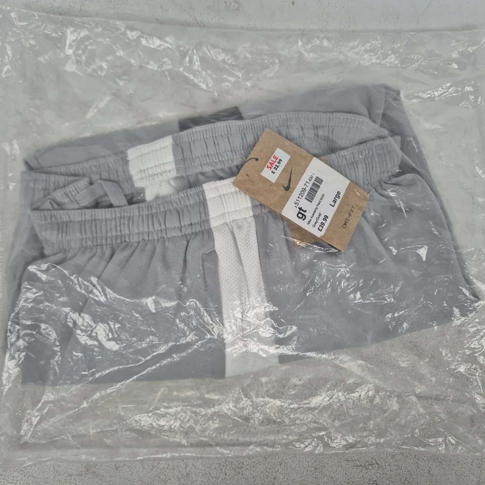 BAGGED NIKE ACADEMY PANTS IN GREY/GOLD SIZE LARGE