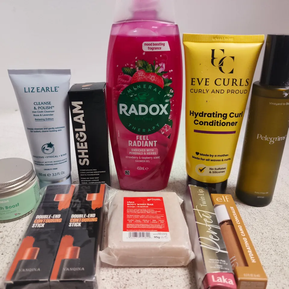 APPROX 12 ASSORTED BEAUTY PRODUCTS TO INCLUDE LIZ EARLE CLEANSER, SHEGLAM FOUNDATION, RADOX SHOWER GEL, ETC 