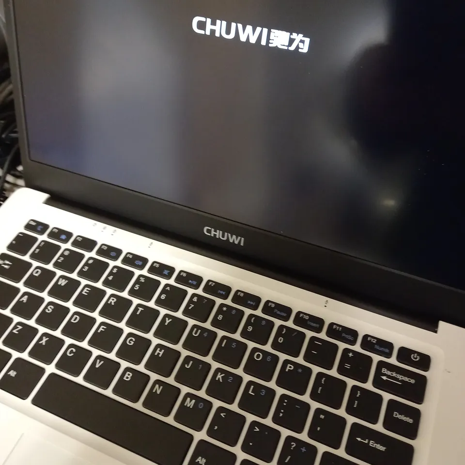 CHUWI WHITE, LAPTOP WITH PINK CASE APPROX. 13.7" SCREEN