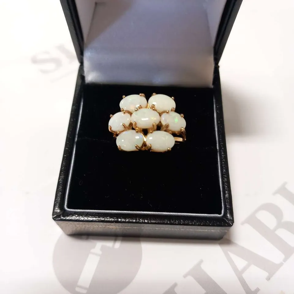 9CT YELLOW GOLD RING SET WITH OPALS WEIGHING +3.00CT