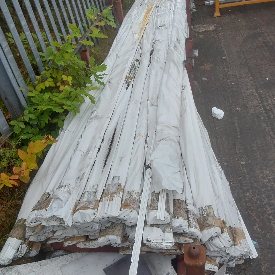 STILLAGE CONTAINING A VERY LARGE QUANTITY OF UNIVERSAL CURTAIN TRACK // STILLAGE NOT INCLUDED
