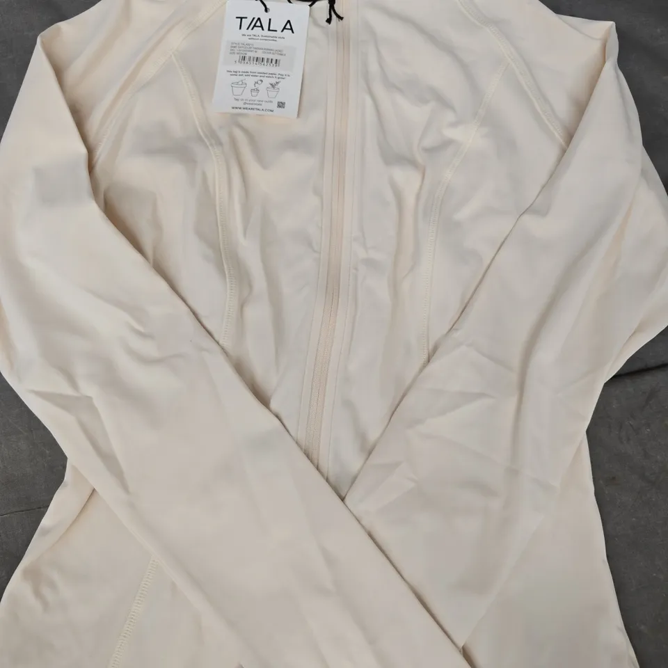 T/ALA DAYFLEX ZIP THROUGH RUNNING JACKET IN BUTTERMILK SIZE MEDIUM