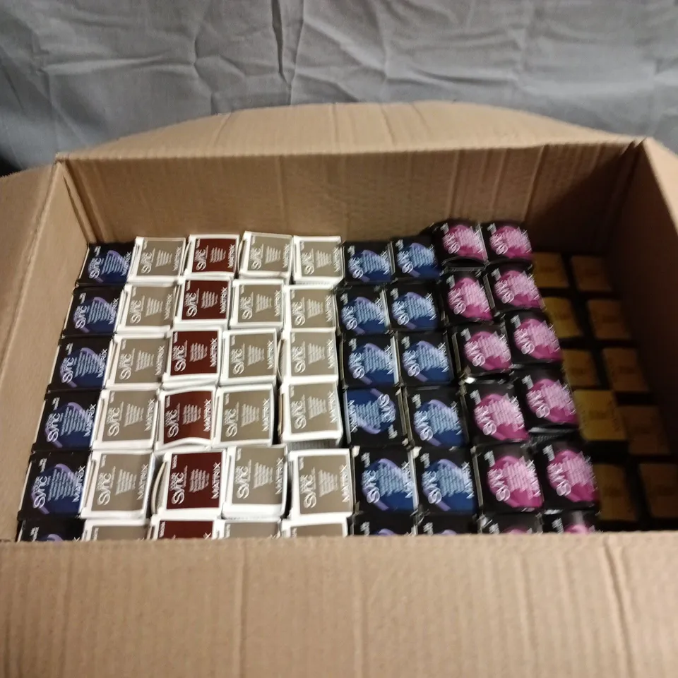 BOX OF APPROXIMATELY 60 HAIR CARE PRODUCTS INCLUDING MATRIX COLOR SYNC MAGENTA/VIOLET/BRUNETTE AND SOBOOST YELLOW
