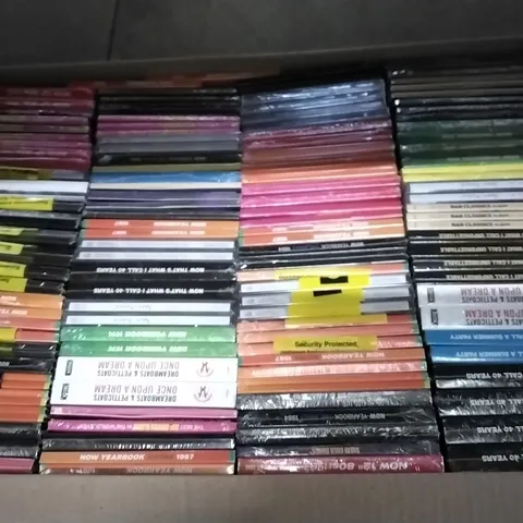 APPROXIMATELY 100 ASSORTED CDS AND DVDS TO INCLUDE NOW MUSIC 18, NOW YEARBOOK, AND NOW THAT'S WHAT I CALL ETC.