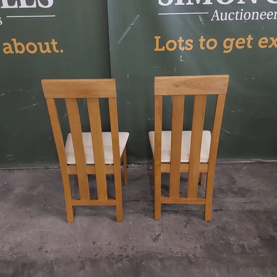 SET OF 2 CHESTER OAK DINING CHAIRS WITH IVORY LEATHER SEAT PADS 