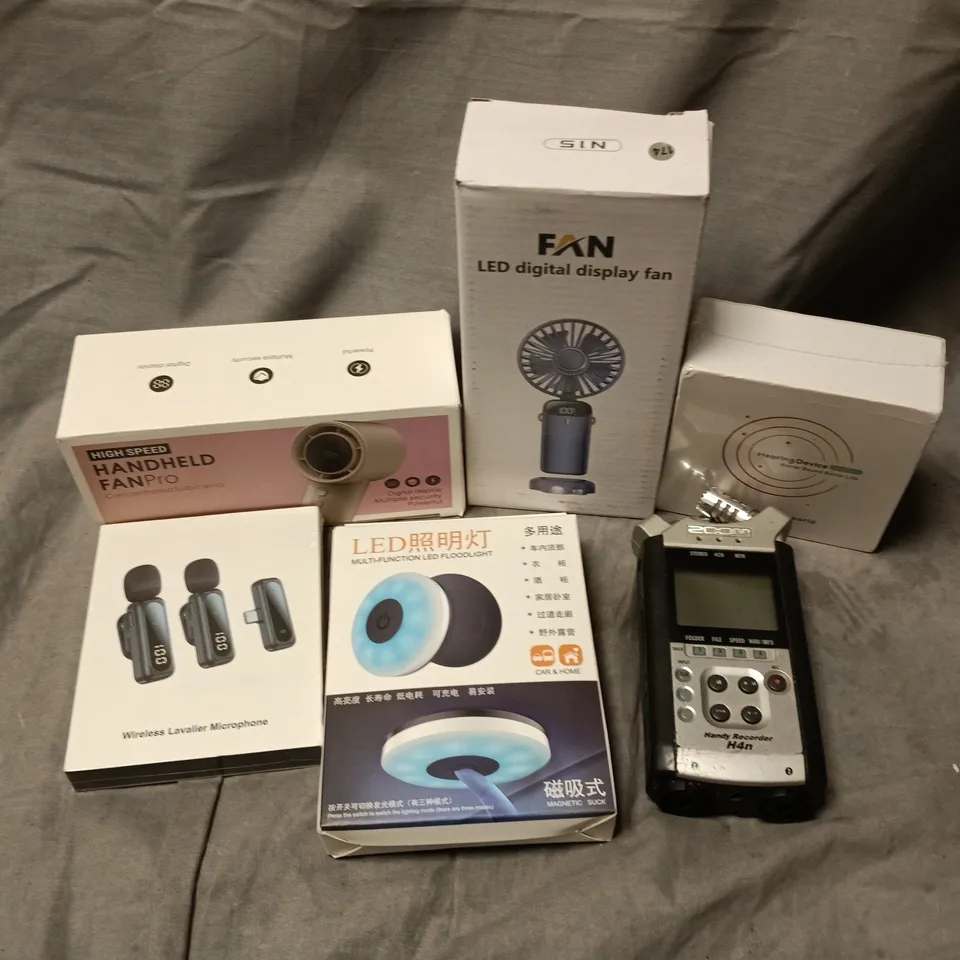 APPROXIMATELY 12 ASSORTED ELECTRICAL ITEMS TO INCLUDE LAVELIER MICROPHONE, LED DIGITAL DISPLAY FAN, HEARING DEVICE, ETC