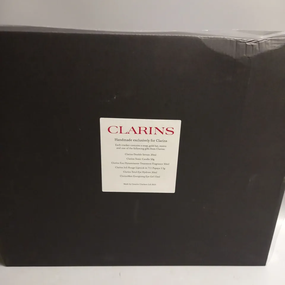 BOXED CLARINS CHRISTMAS CRACKER GIFT SET INCLUDES A CLARINS PRODUCT