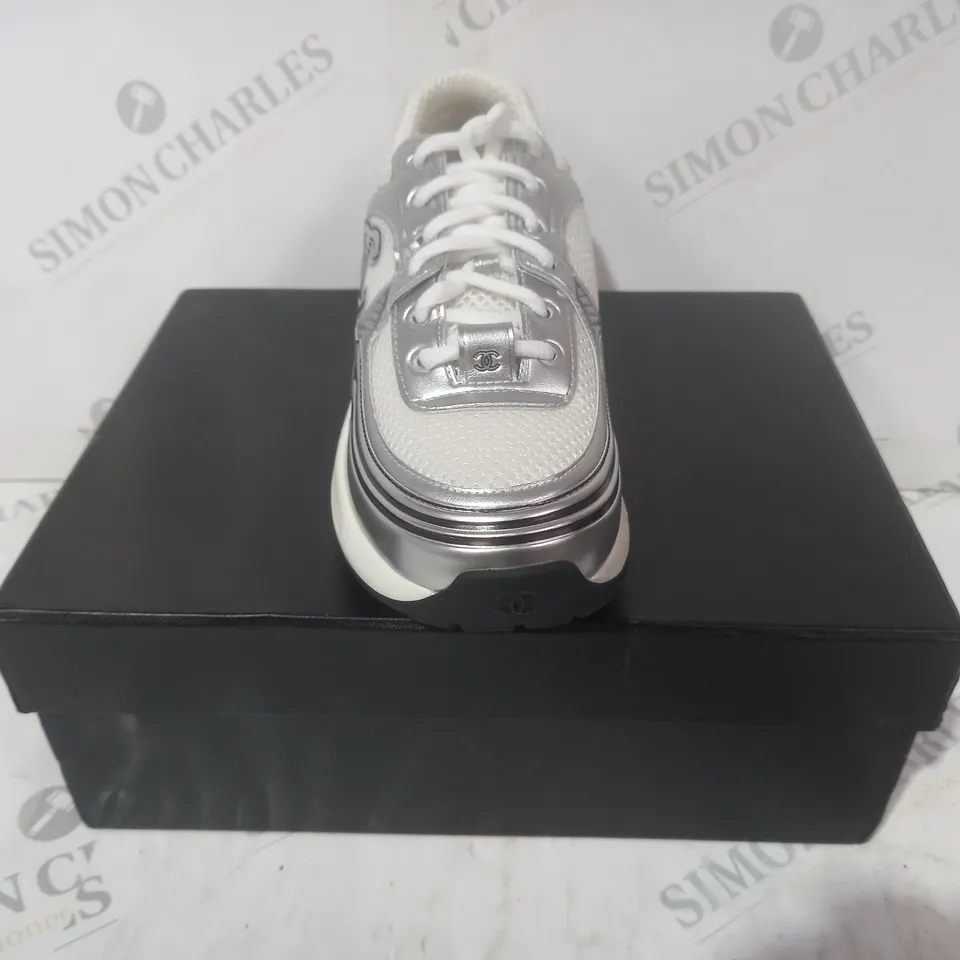 BOXED PAIR OF CHANEL TRAINERS IN WHITE/BLACK/METALLIC SILVER EU SIZE 39