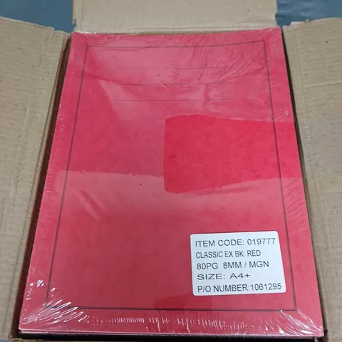 APPROXIMATELY 30 RED EXERCISE BOOKS