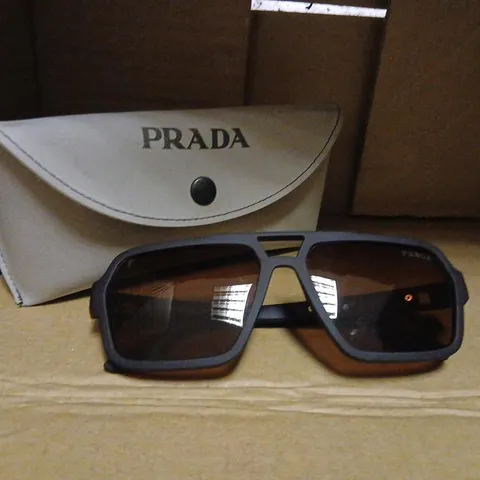 PRADA SUNGLASSES WITH BLACK FRAME AND BROWN LENSES β INCLUDES GREY PRADA CASE