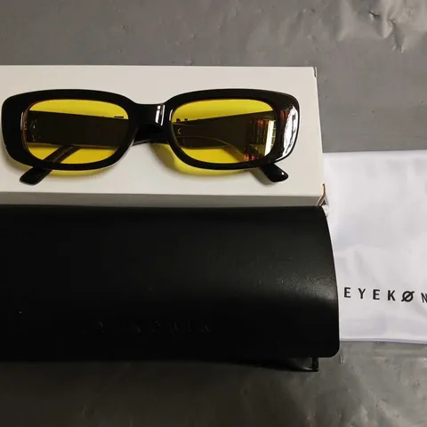 BOXED PAIR OF EYEKONIK BLACK FRAMED GLASSES WITH YELLOW TINT LENS