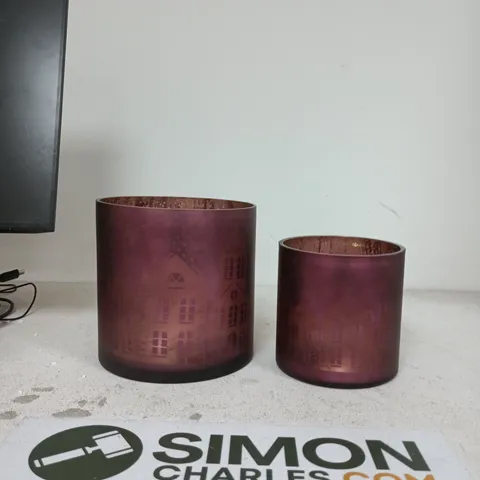 PAIR OF PURPLE FROSTED GLASS LIGHTS WITH ETCHED CITYSCAPE MOTIF