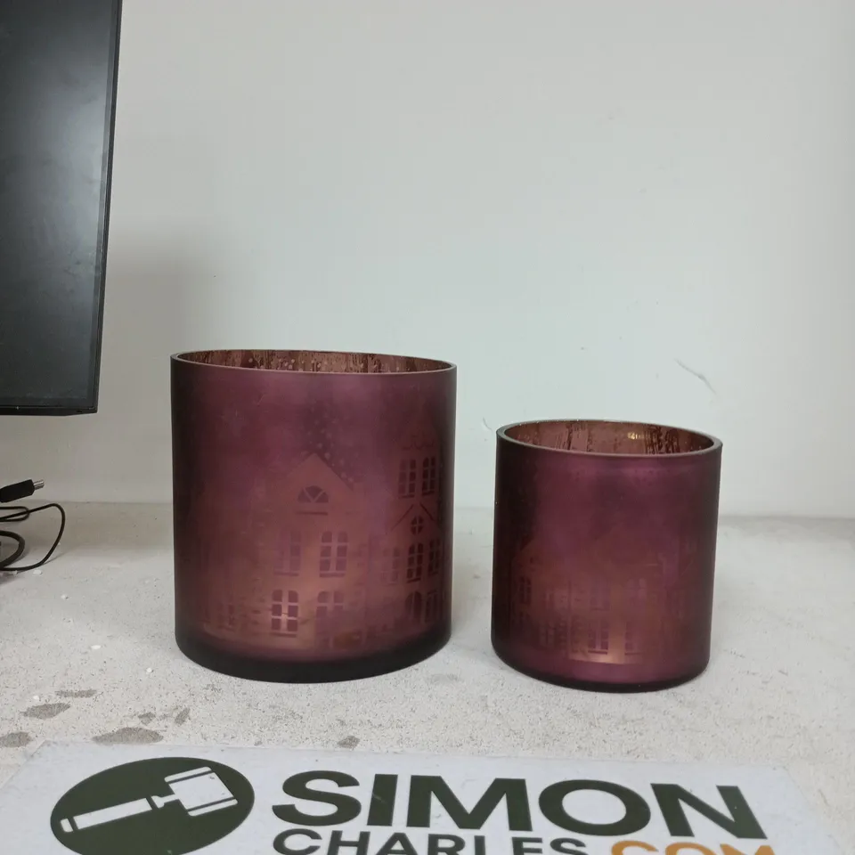 PAIR OF PURPLE FROSTED GLASS LIGHTS WITH ETCHED CITYSCAPE MOTIF
