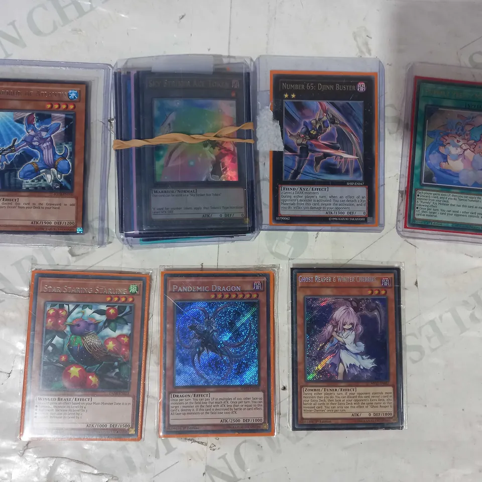 SMALL ASSORTMENT OF COLLECTIBLE YU-GI-OH TRADING CARDS
