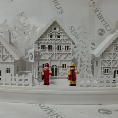 WHITE WOOD LIT VILLAGE SCENE