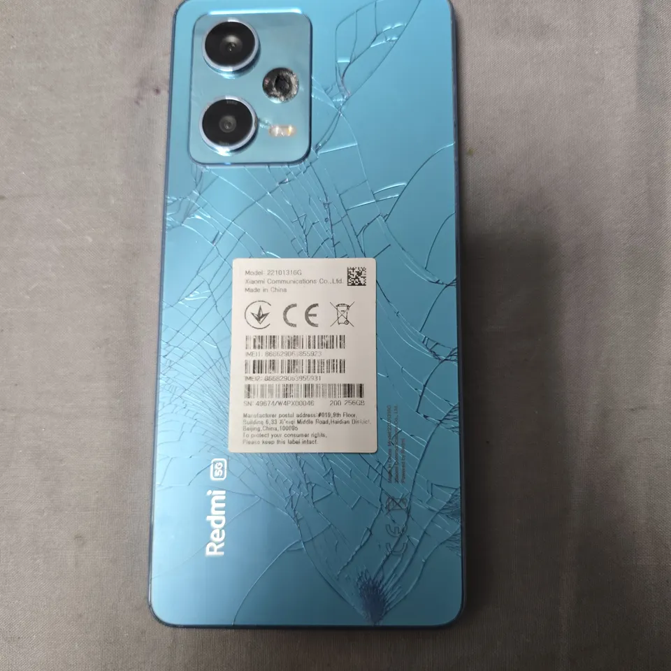 XIAOMI REDMI 5G SMARTPHONE – BLUE, REAR GLASS CRACKED