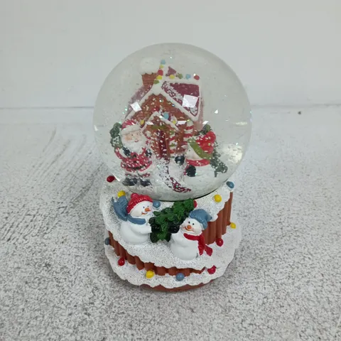 DECORATIVE CHRISTMAS SNOW GLOBE WITH SANTA, SNOWMEN AND COTTAGE SCENE