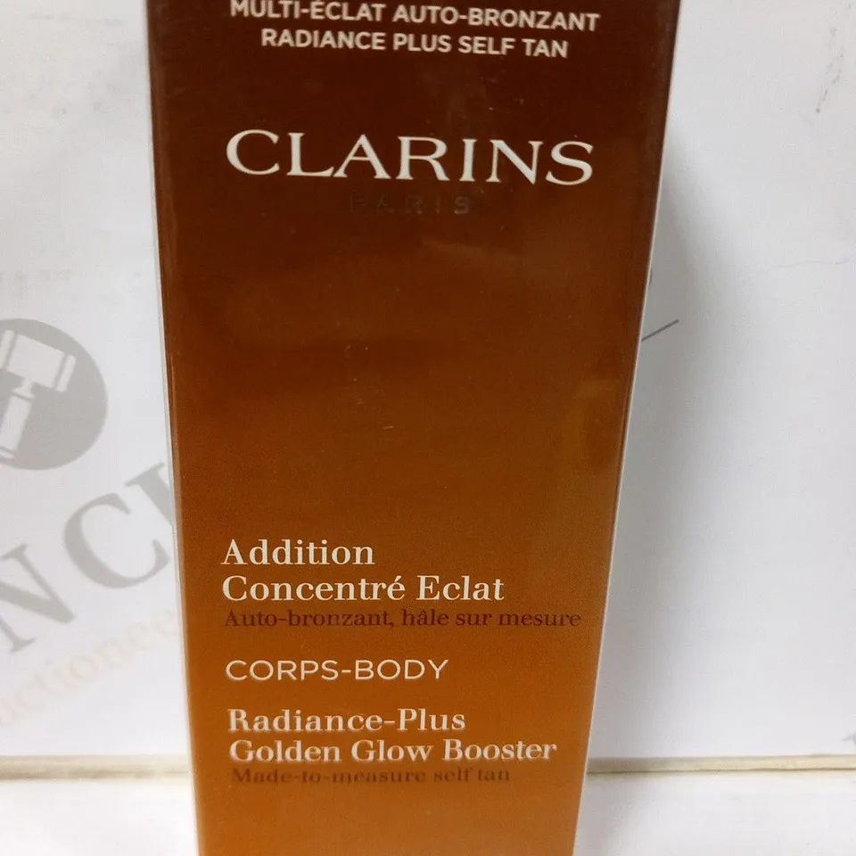 APPROXIMATELY 28 BOXED CLARINS PARIS RADIANCE PLUS GLDEN GLOW BOOSTER 30ML