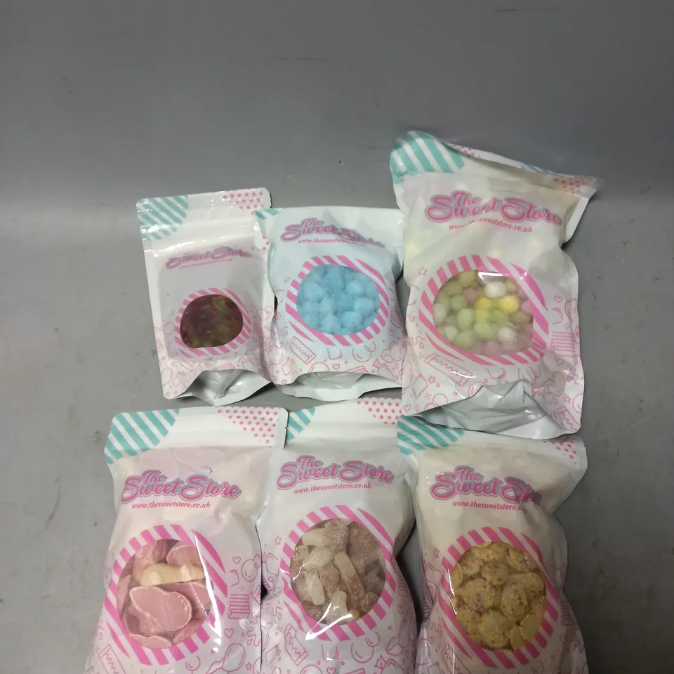 6 LARGE PACKS OF SWEERS BY THESWEETSTORE TO INCLUDE MINI EGGS, COLA BOTTLES, AND BONBONS ETC. 