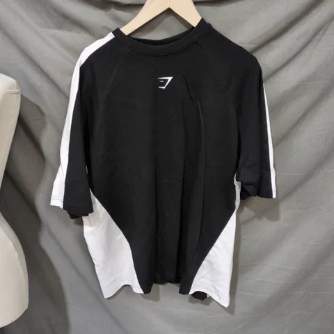 GYMSHARK T-SHIRT – BLACK WITH WHITE SIDE PANELS, SIZE M