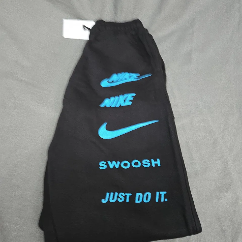 NIKE GRAPHIC TRACKSUIT BOTTOMS SIZE L