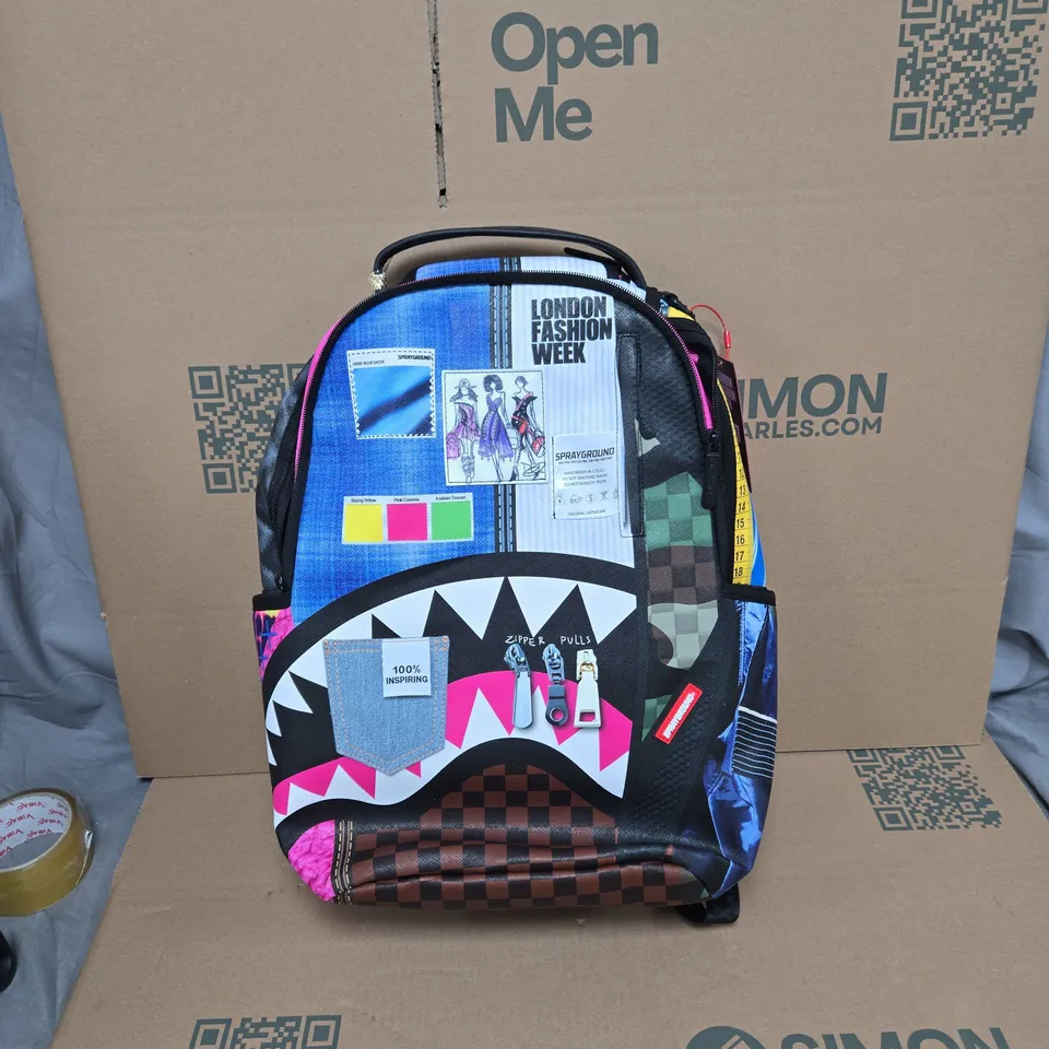 SPRAYGROUND LONDON FASHION WEEK BACKPACK – MULTICOLOURED GRAPHIC DESIGN WITH TAGS