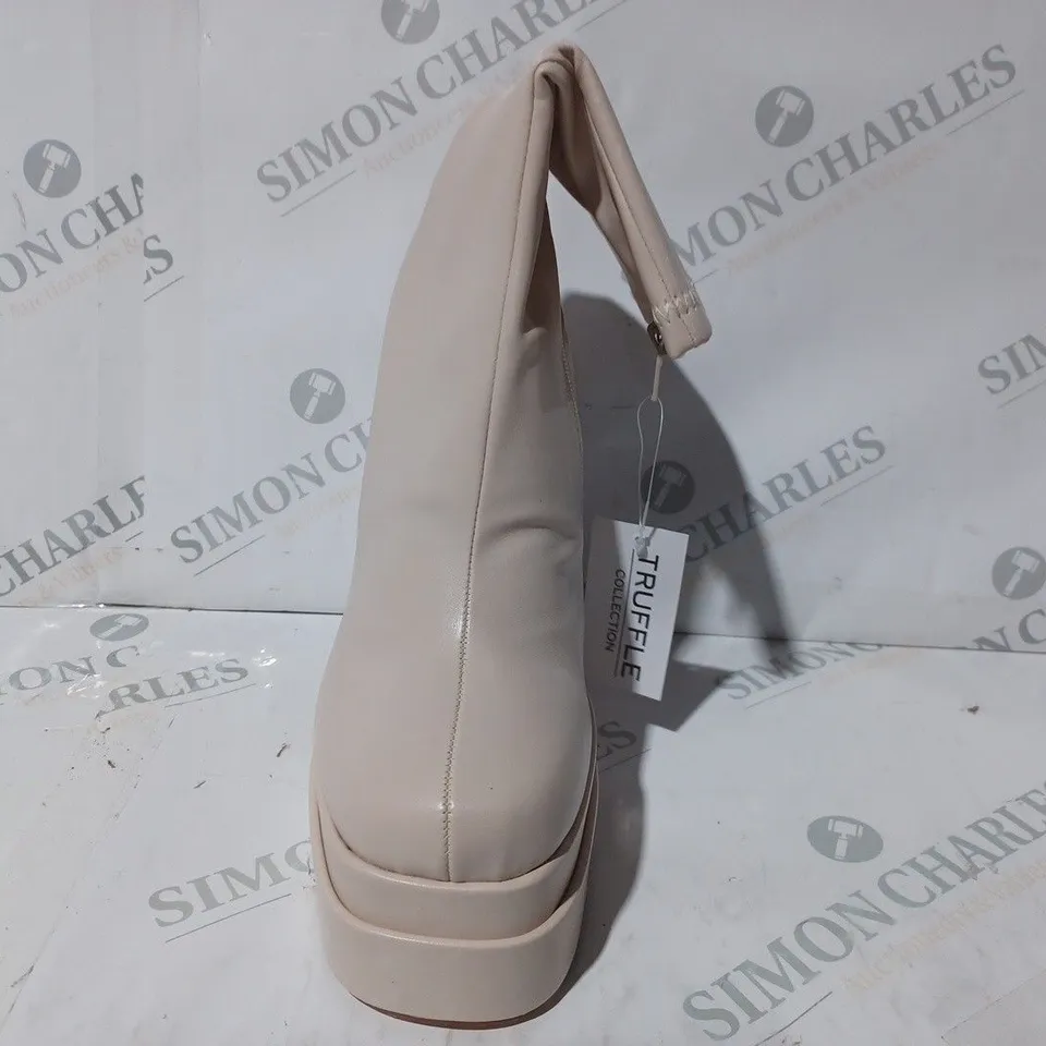 BOXED PAIR OF TRUFFLE COLLECTION PLATFORM HIGH BLOCK HEEL BOOTS IN CREAM SIZE 7