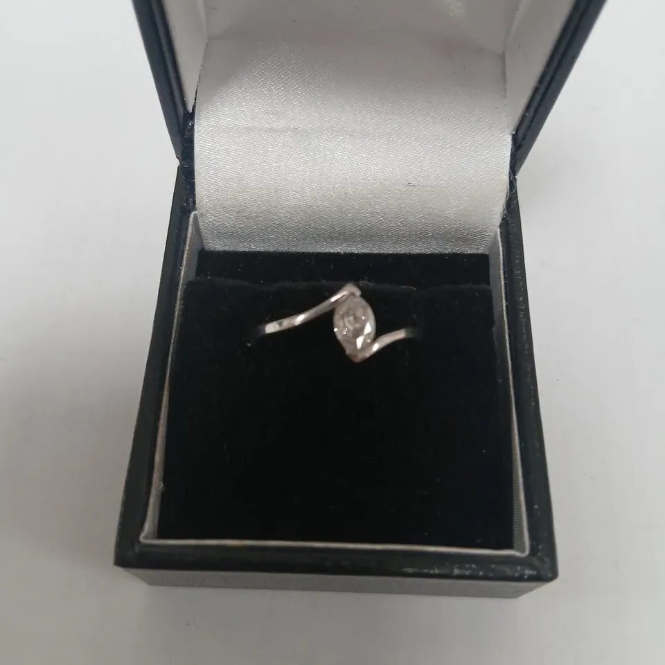 18CT WHITE GOLD SOLITAIRE RING SET WITH A MARQUIS CUT DIAMOND