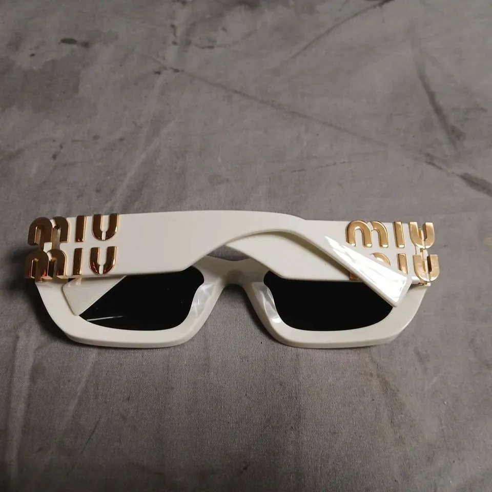 MIU MIU WHITE FRAME SUNGLASSES WITH GOLD LOGO ARMS