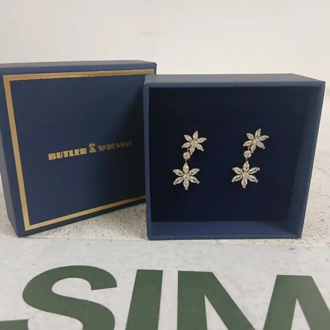 BUTLER & WILSON FLOWER DROP EARRINGS – SILVER-TONE WITH CLEAR STONES (BOXED)