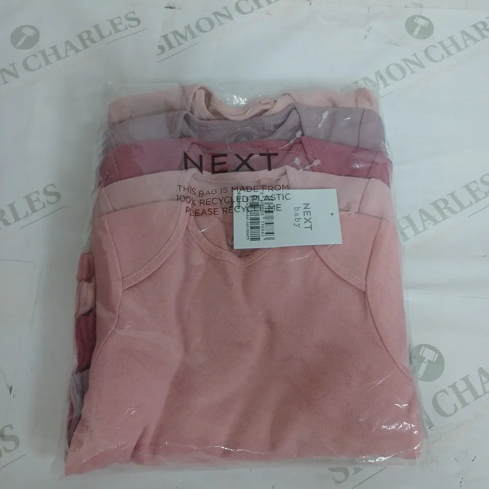 SEALED NEXT BABY SET OF 4 BODY SUITS - 6-9 MONTHS