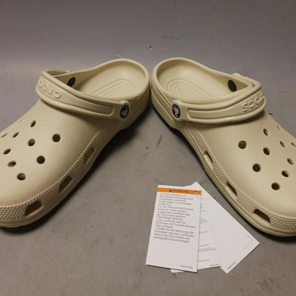 PAIR OF CROCS CLOGS IN BONE UK SIZE 7