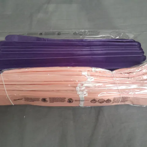 LARGE QUANTITY OF TISSUE PAPER DECORATIONS IN PURPLE AND PINK
