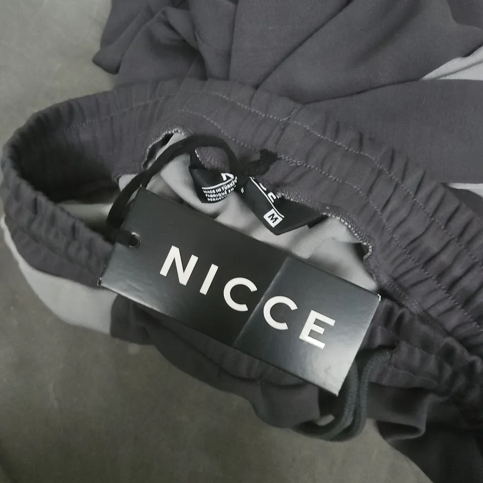 NICCE CONVEX INTERLOCK JOGGERS IN CIRCULAR GREY - MEDIUM