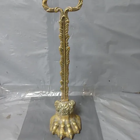 BRASS ANTIQUE STYLE DOOR STOP WITH A LION'S PAW BASE, FEATHER STEM AND A LOOP HANDLE 