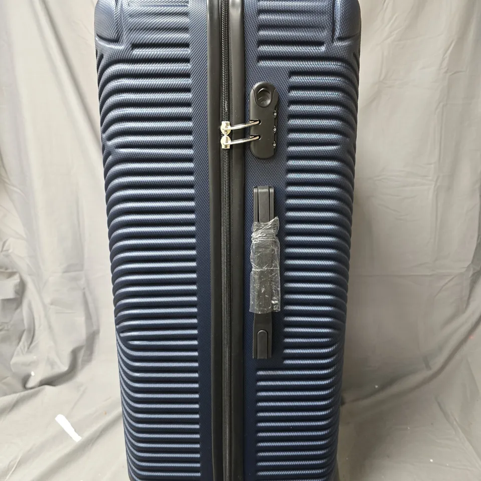 BLOOMLITE BLUE HARD-SHELL SUITCASE WITH 4 WHEELS - DIAGONAL RIBBED TEXTURE (136L)