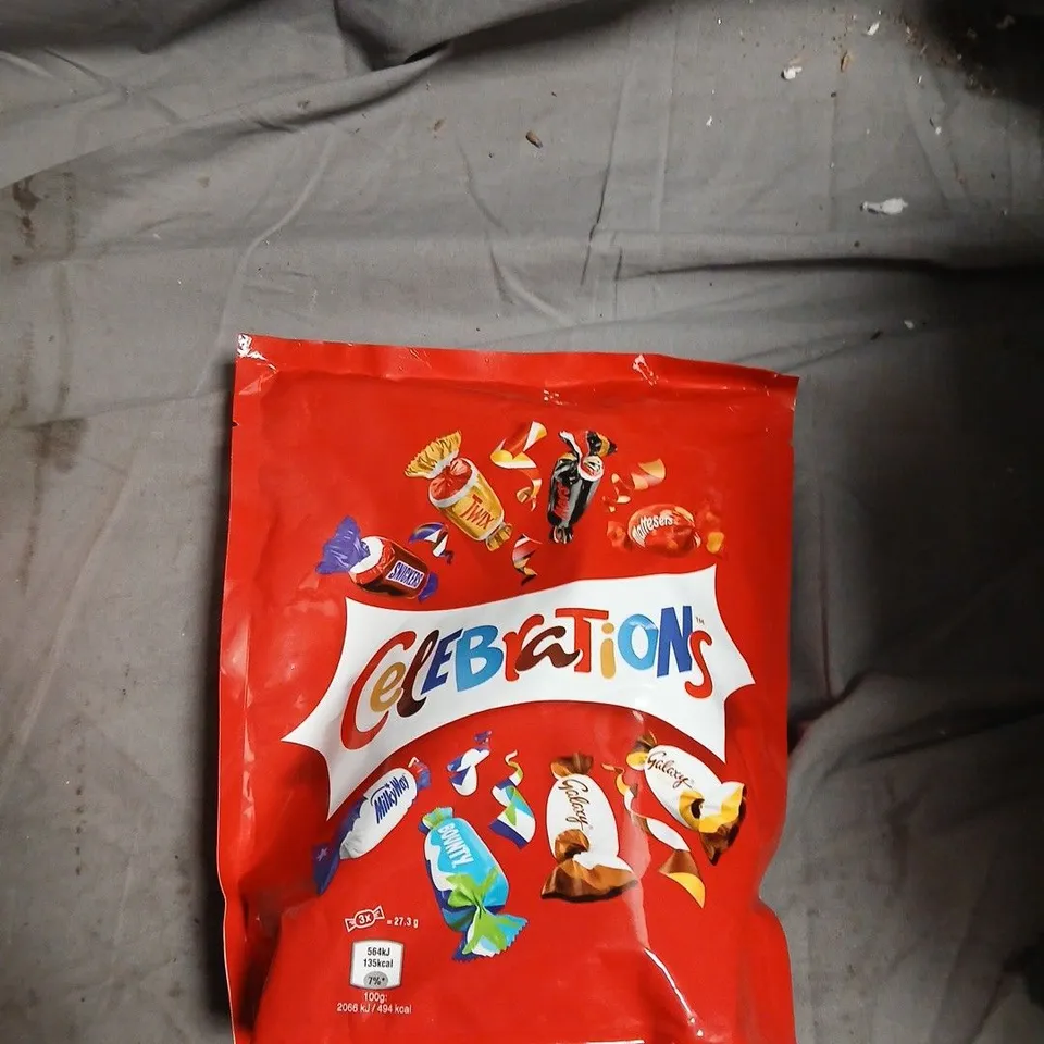 BOX OF APPROXIMATELY 12 ASSORTED FOOD ITEMS INCLUDING CELEBRATIONS , JELLY BABIES AND ORGANIC COCONUT MILK