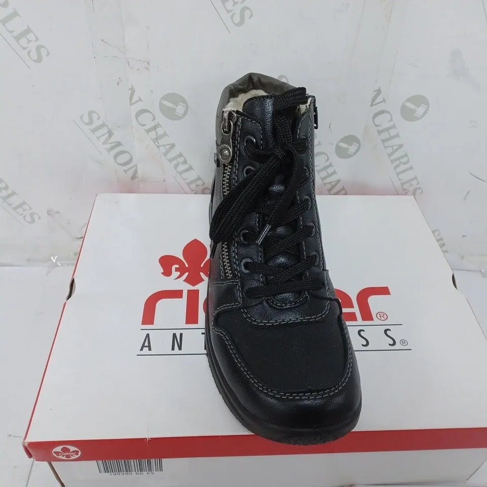 BOXED PAIR OF RIEKER WATER RESISTANT BOOTS IN BLACK SIZE 5