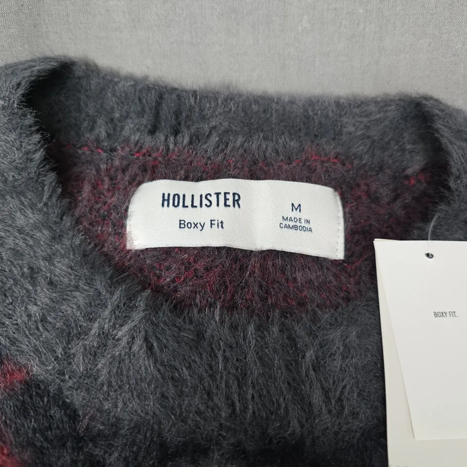 HOLLISTER BOXY FIT JUMPER – GREY/CHARCOAL ARGYLE KNIT, SIZE M