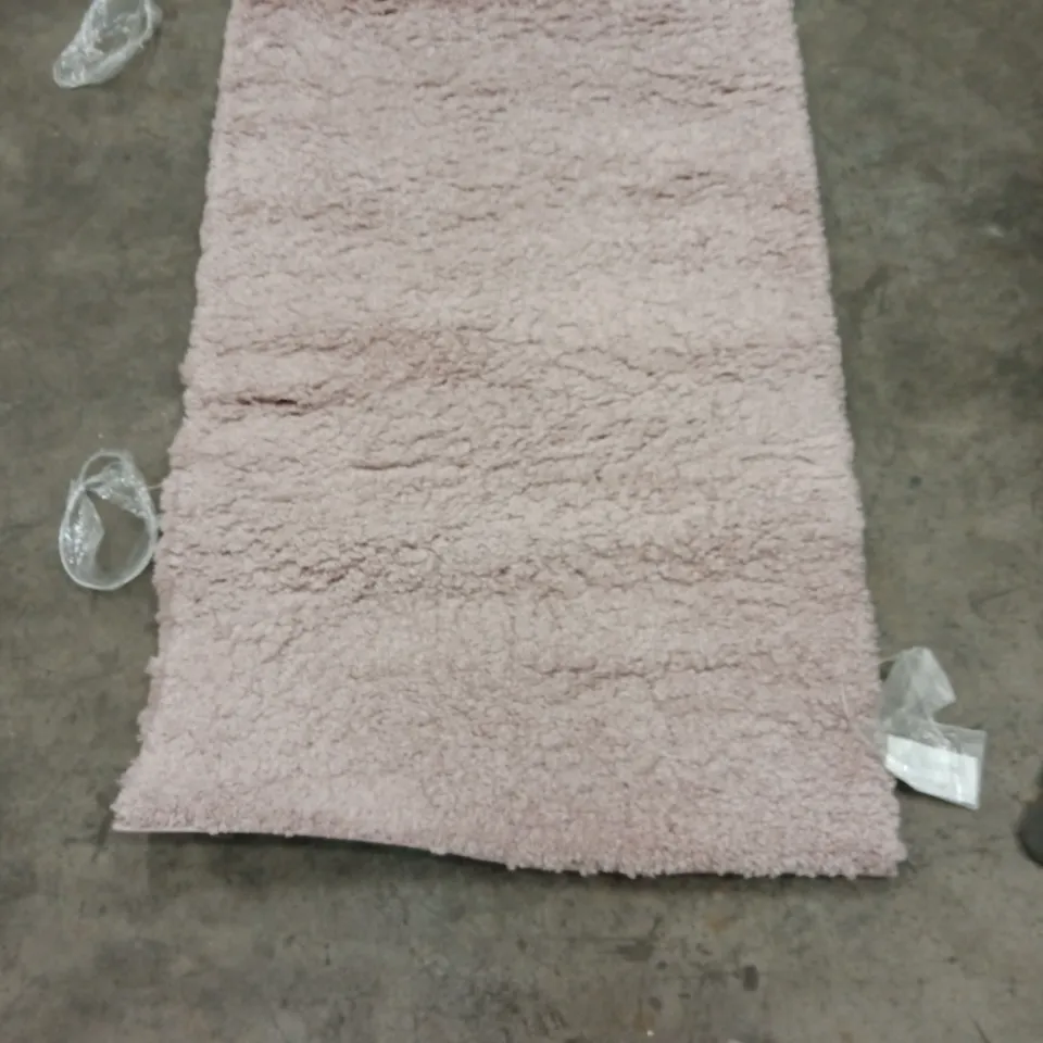 STILLAGE OF APPROXIMATELY 20 DESIGNER RUGS