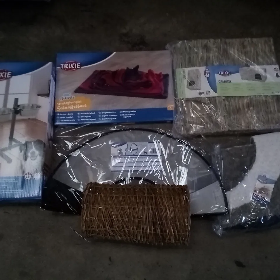 PALLET OF 2 BOXES CONTAINING ASSORTED TRIXIE PET SUPPLIES INCLUDING DOG CONE, PET BEDS, GRASS HOUSE, BAR FOR DOGS, STRATEGY GAME 