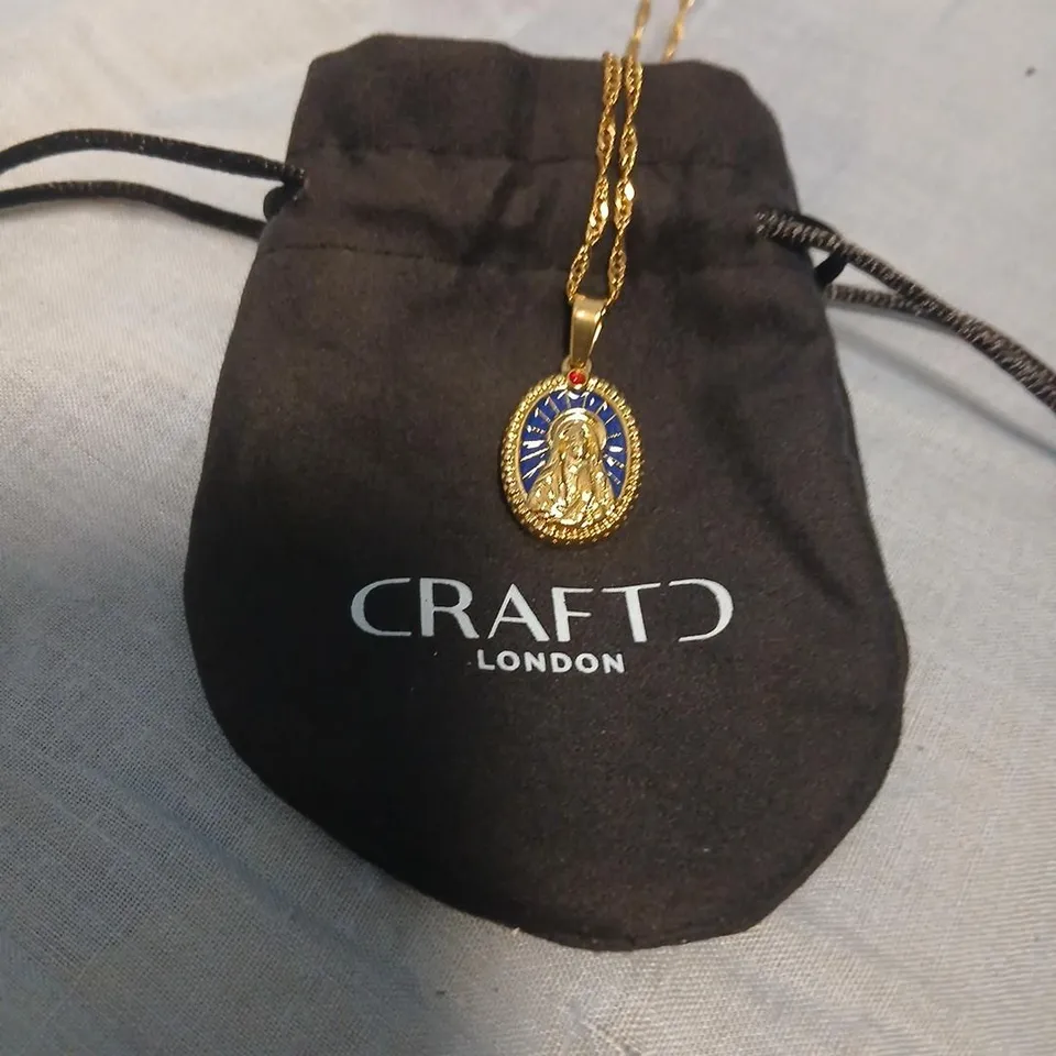 CRAFT LONDON GOLD-TONE SAINT PENDANT NECKLACE WITH BLUE ENAMEL OVAL MEDALLION