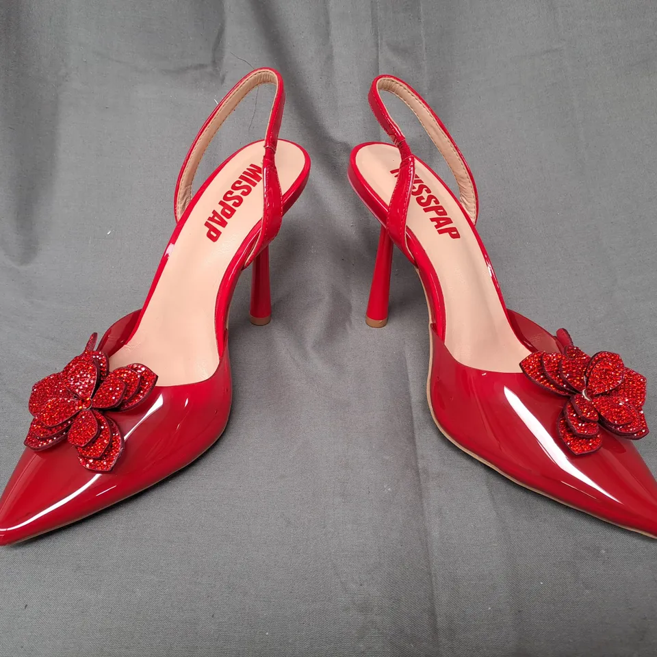 BOXED PAIR OF MISSPAP POINTED TOE HIGH HEEL SANDALS IN RED W. FLORAL DETAIL SIZE 4