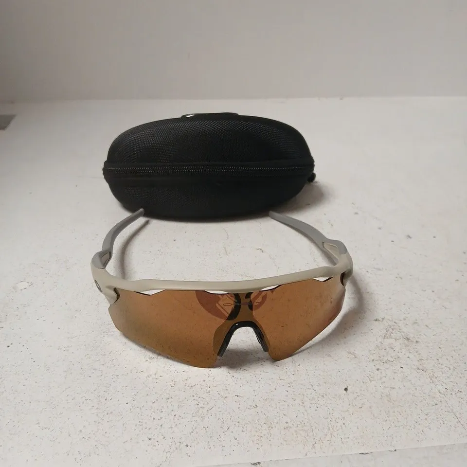 BOXED OAKLEY WRAP ROUND SUNGLASSES WITH CASE