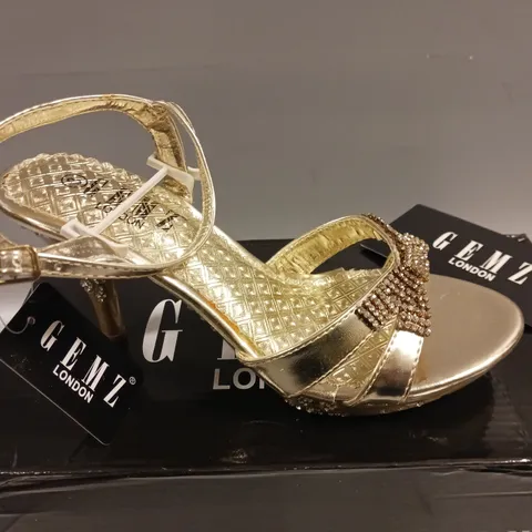 LOT OF 11 BOXED PAIRS OF GEMZ LONDON STRAPPY HEELED SHOES IN GOLD - VARIOUS SIZES 3/4/5/6/7