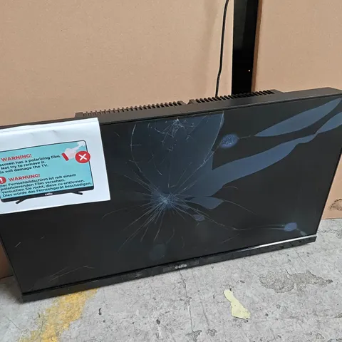 BOXED cello 22" smart traveller fhd TV - powers on - damaged screen 