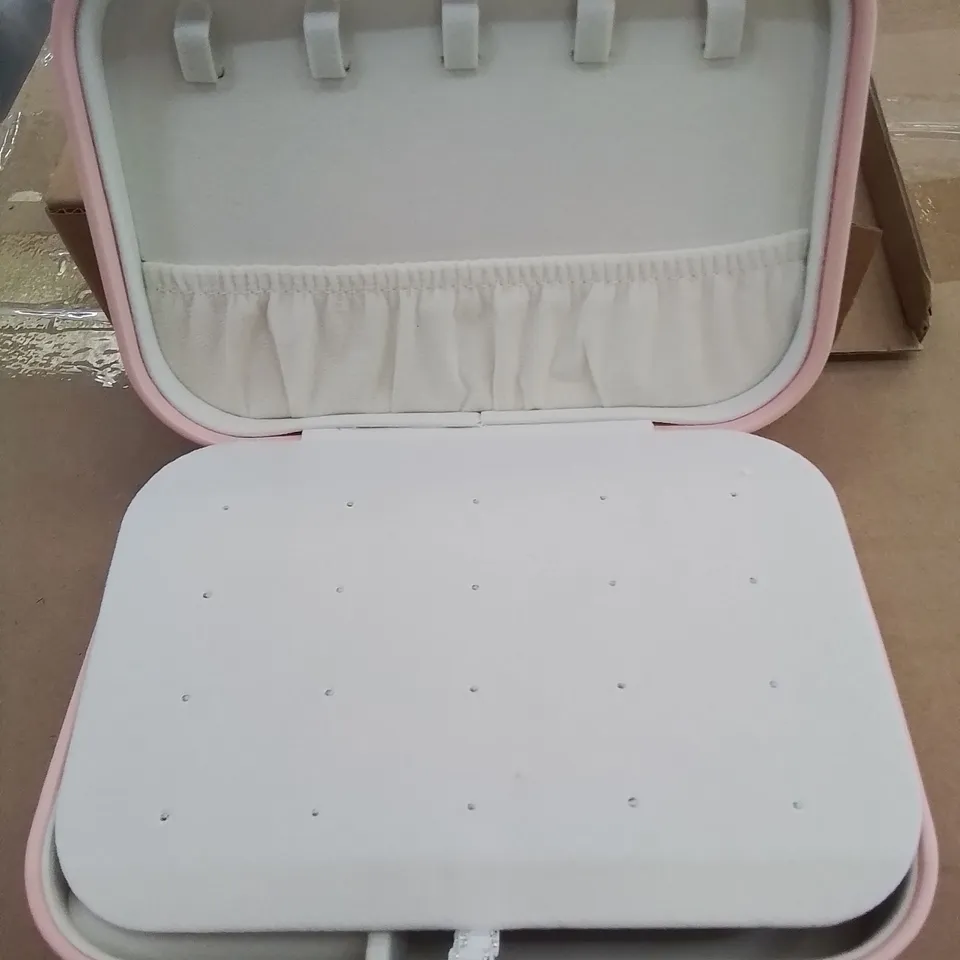 A BOX OF APPROXIMATELY 50 VANITY CASES IN PINK