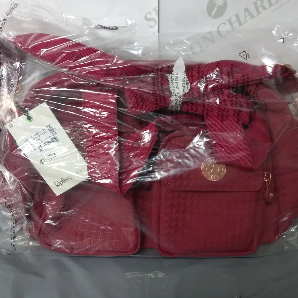 RED KIPLING STRAPPED BAG WITH OUTER POCKETS ALSO INCLUDE WALLET 