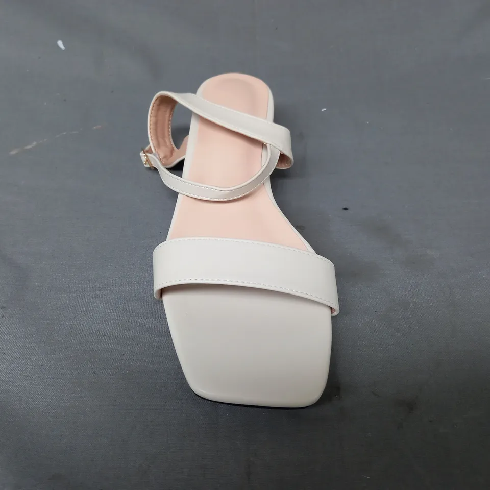 BOXED PAIR OF DESIGNER OPEN TOE LOW HEEL SANDALS IN CREAM EU SIZE 38